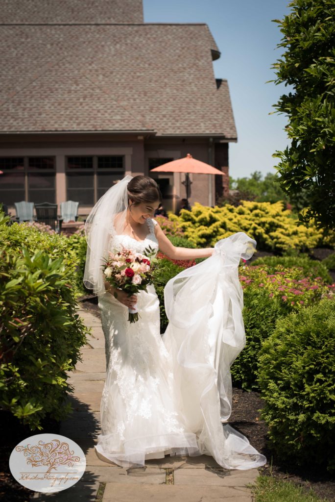 Bride swishes wedding dress Belhurst Castle