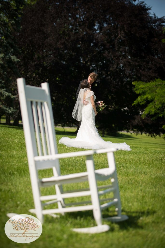 Bride and Groom rocking chair in focus