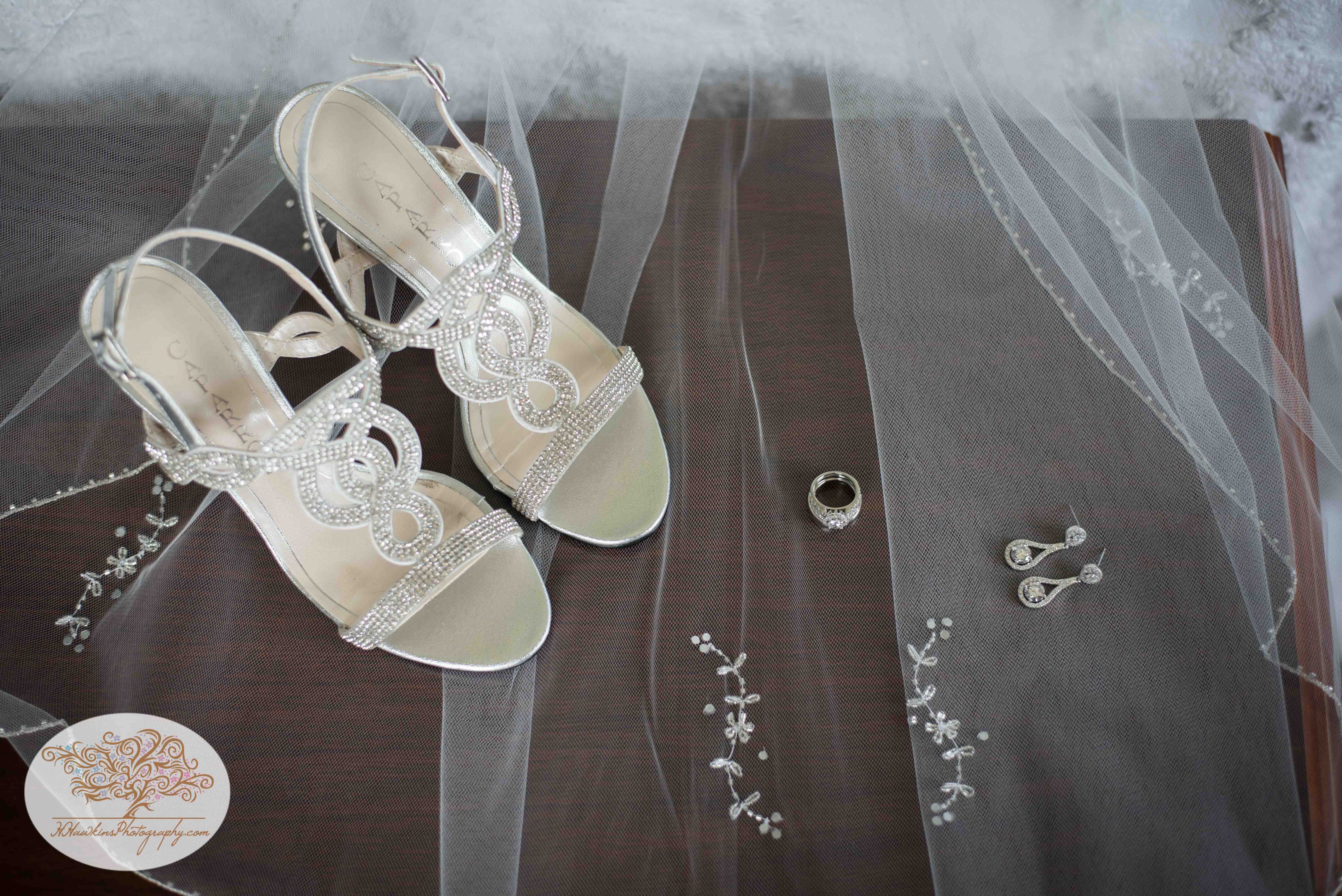 Bride's shoes, wedding rings and earrings