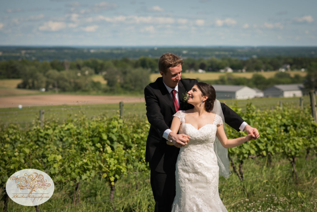 Bride and Groom kissing in a vineyard