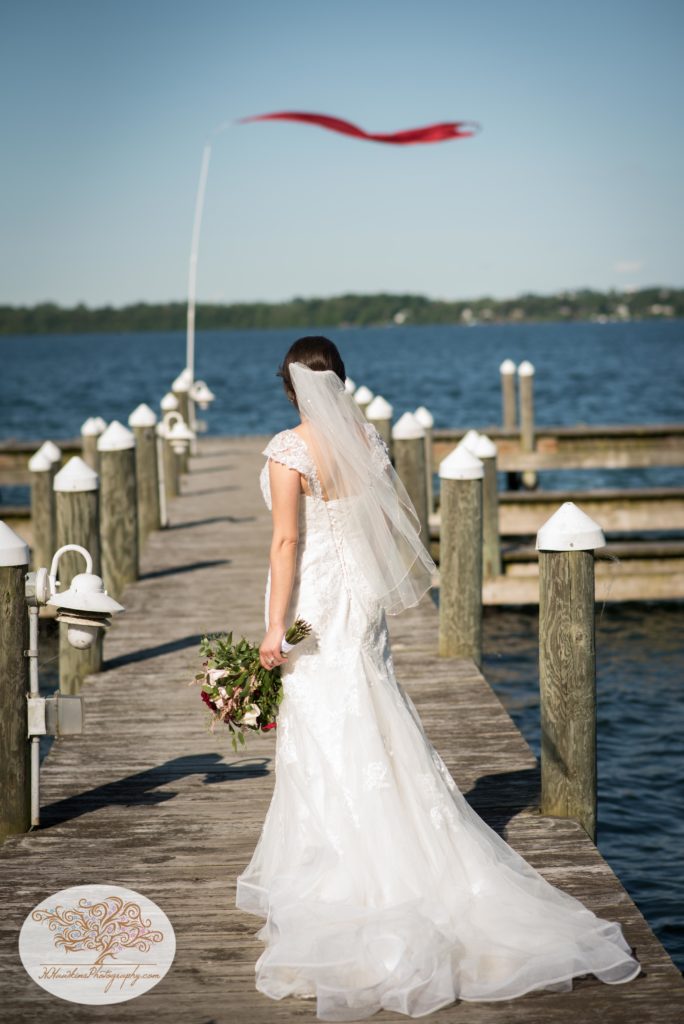 Bride on the docks of Belhurst Castle on Seneca Lake Geneva NY