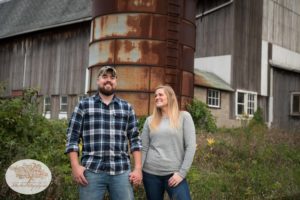 Engagement session with bride and groom in front of old silo