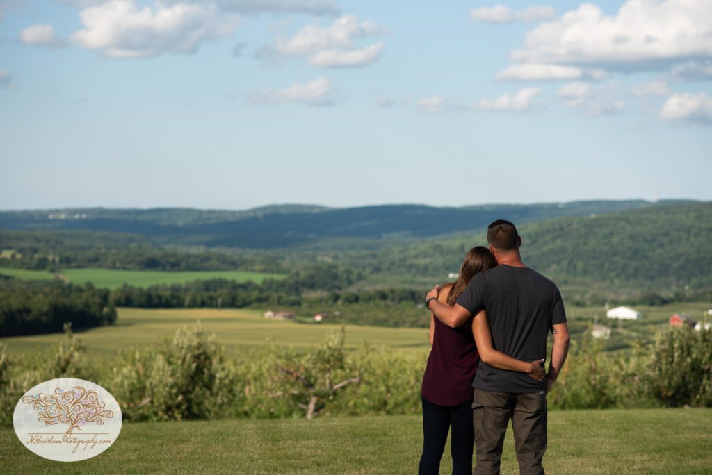 Bride and groom enjoy the view of Lafayette NY at Beak and Skiff's Distillery