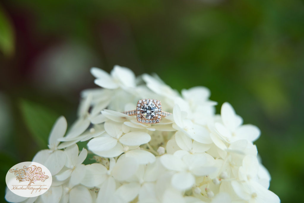 Gorgeous rose gold engagement diamond ring on a hydrangea flower