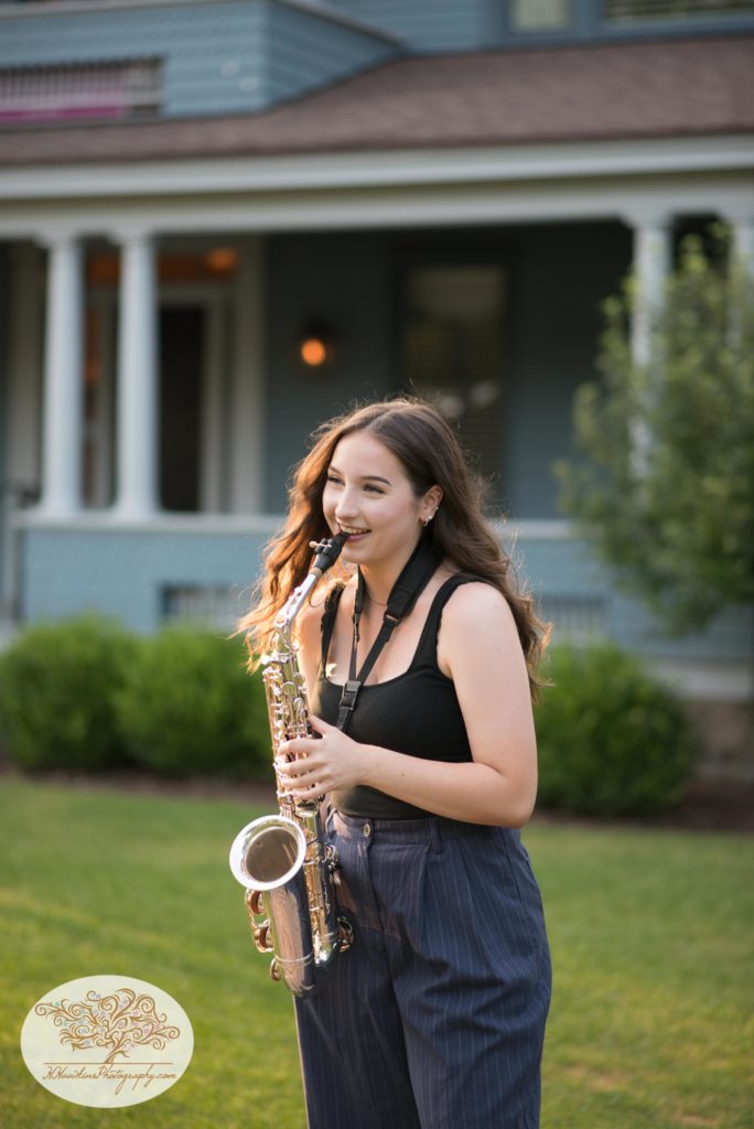 Senior picture of girl playing saxaphone in Skaneateles NY