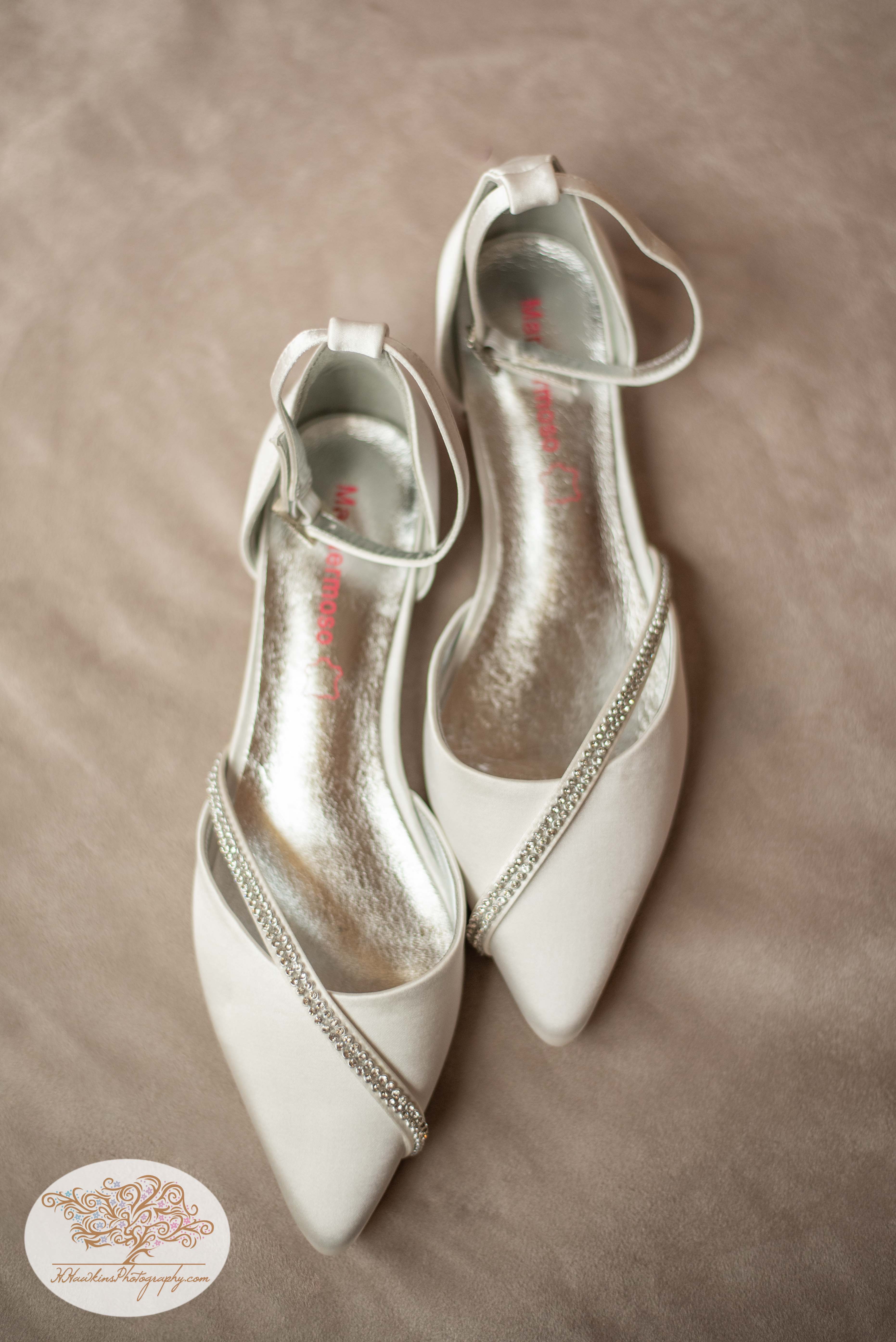 bride's wedding shoes with sparkles on them