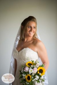 Bridal portrait with bouquet of sunflowers for upstate ny barn wedding