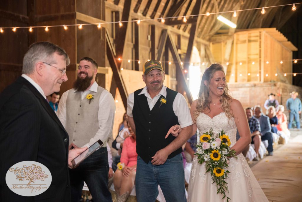 Bride laughs as father gives her away at Upstate NY barn wedding