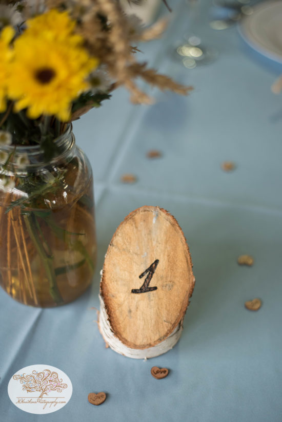 Table number made of white birch and flower centerpiece for Upstate NY barn wedding