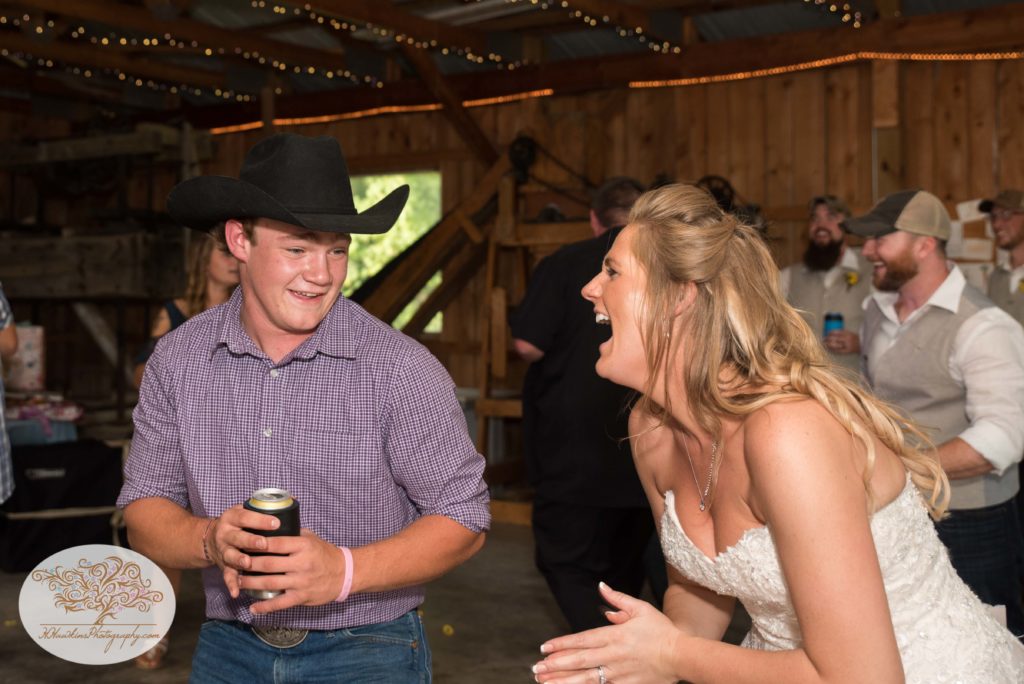 Bride dances cowboy during reception at Owen Orchard in Weedsport NY