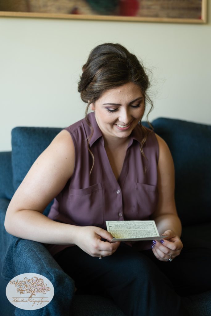 Bride reads a love letter from her groom on her wedding day