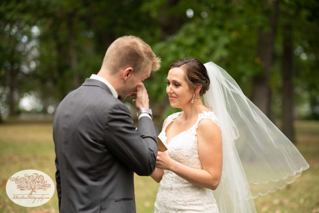Bride and groom cry during the first look