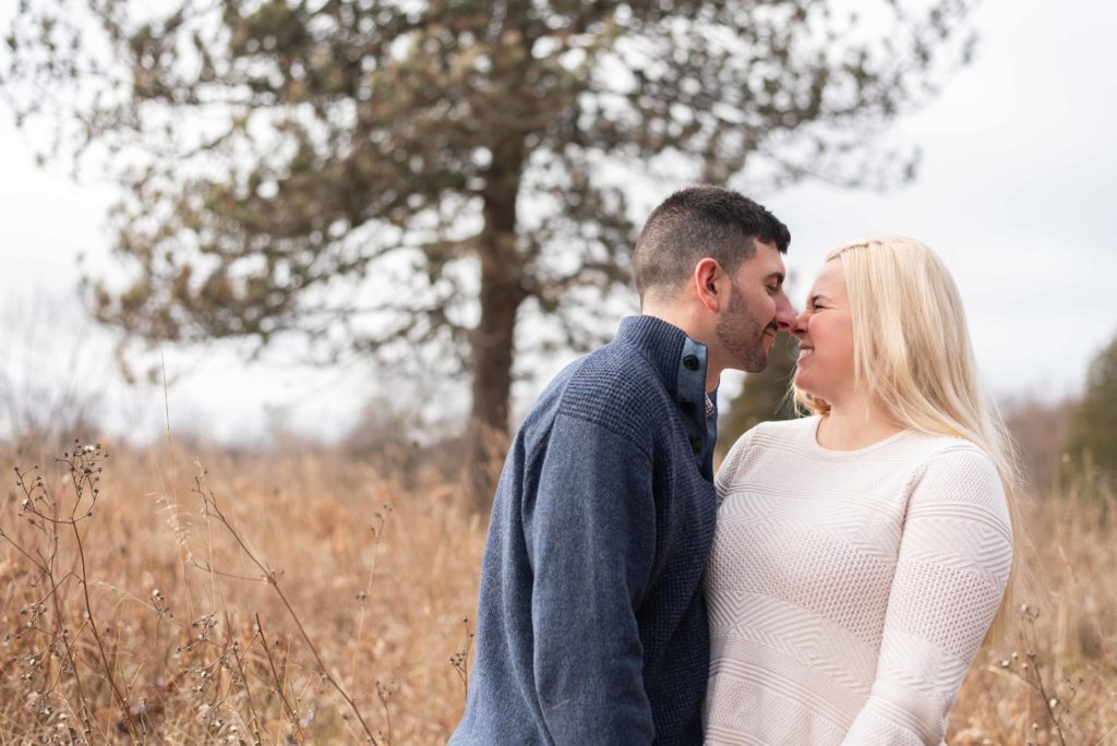 Bride gives her groom an eskimo kiss during their Fall Syracuse engagement photos