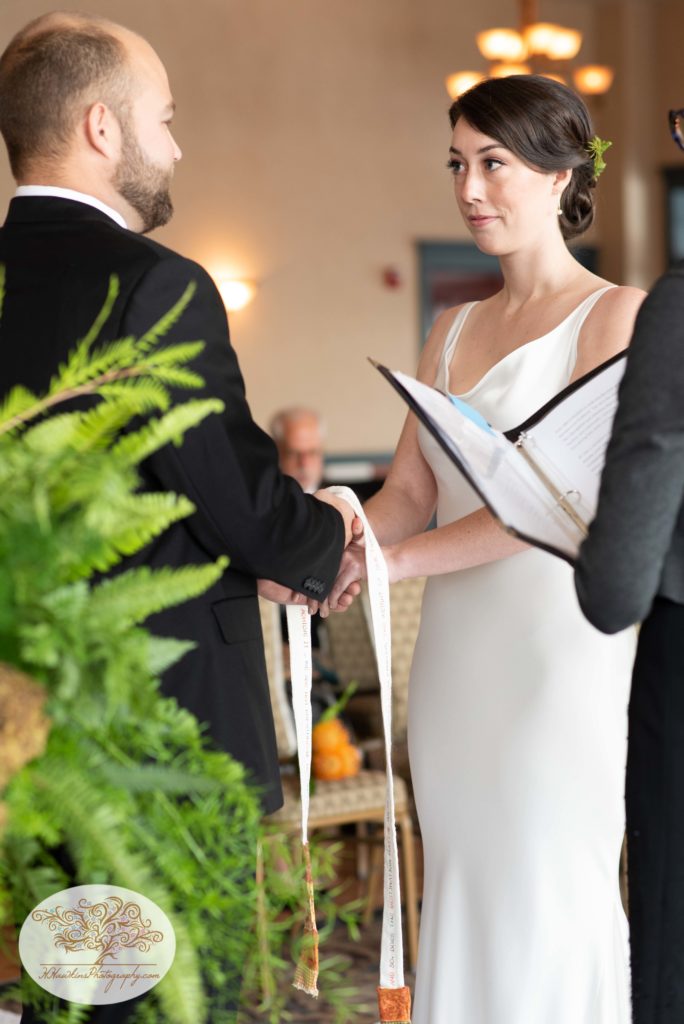Hand binding ceremony at wedding at Belhurst Castle
