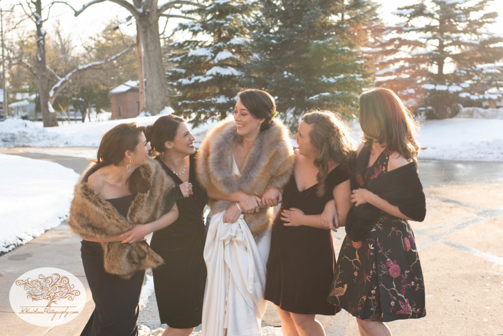 Bride and her girlfriends laugh together