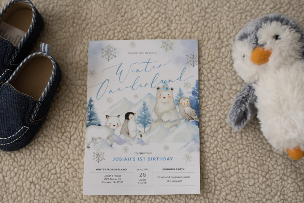 Penguin birthday party invitation with arctic animals on it
