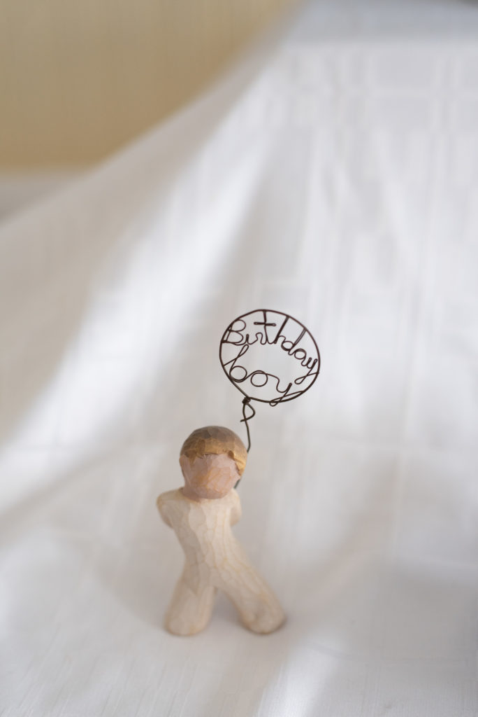 Willow tree figurine with birthday boy balloon