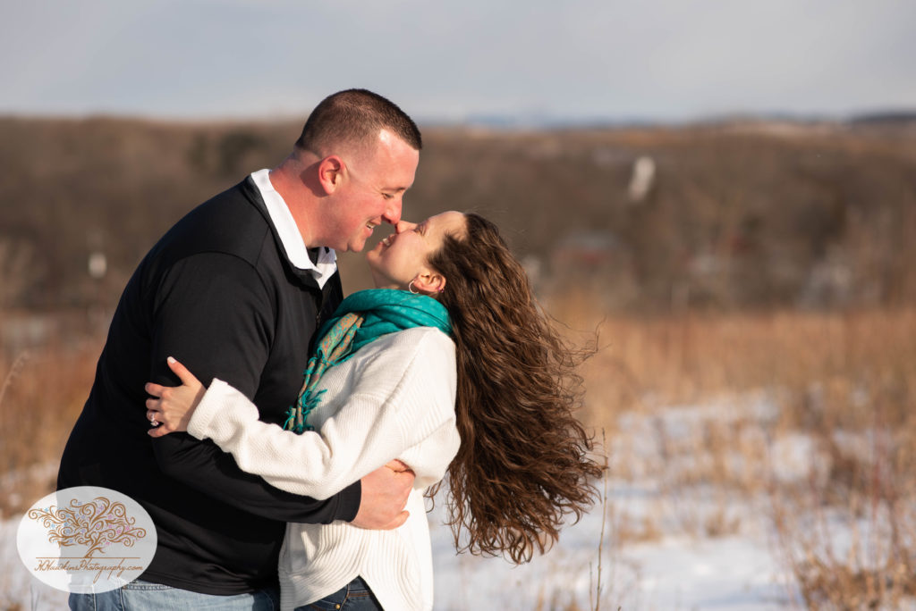 Bride and groom to be give each other Eskimo kisses during their engagement session