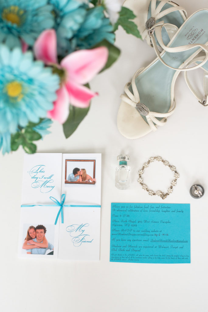 wedding invitation, bouquet, shoes, perfume, bracelet, and rings