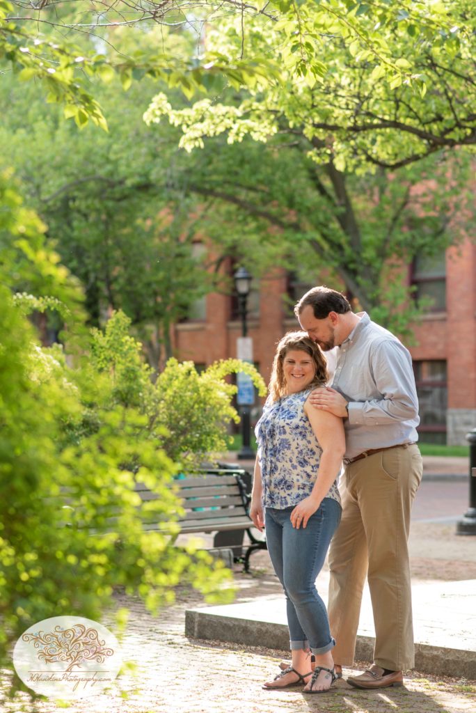 Bride and Groom stand in Franklin Square Park for their engagement photos