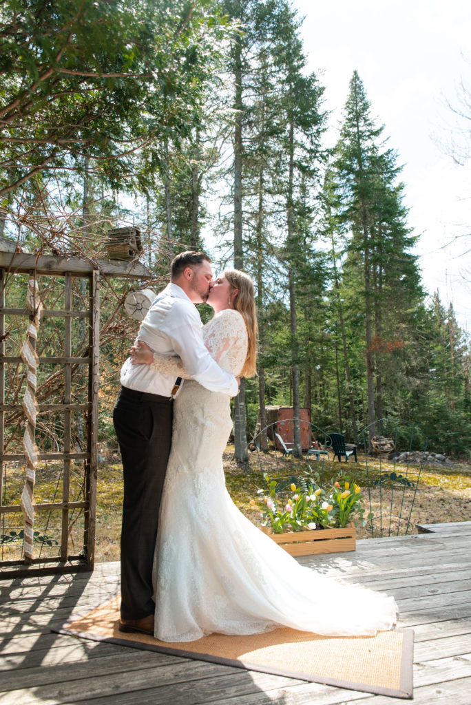 Adirondack wedding photographer captures bride and groom holding ceremony in the mountains of Lake Placid
