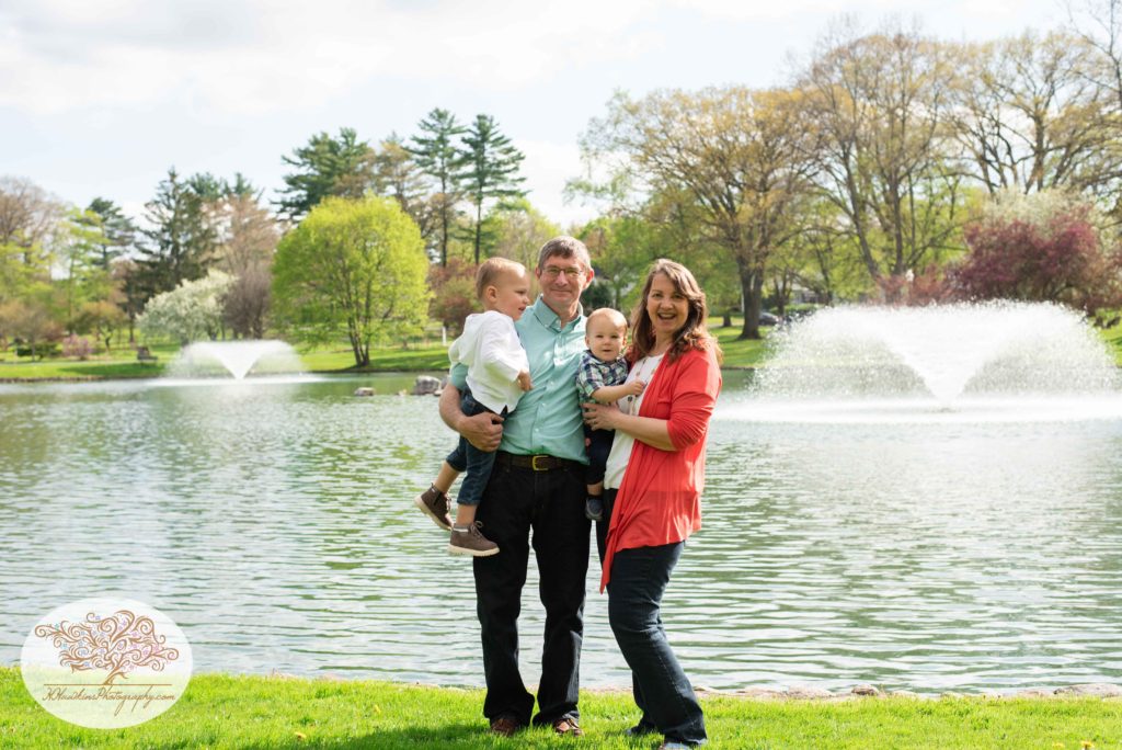 Grandparents stand in front of fountains at Hoopes Park in Auburn NY