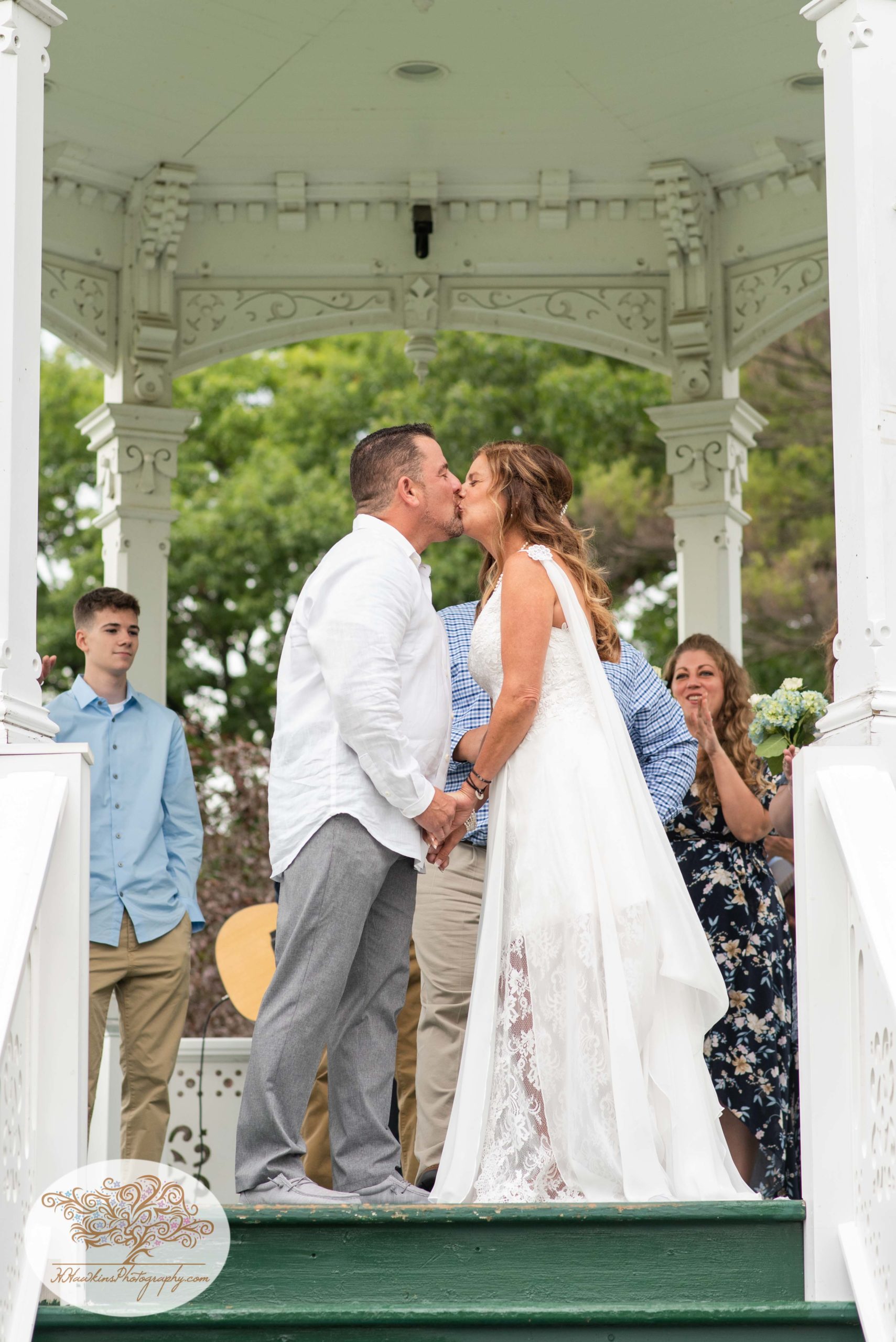 Bride and groom kiss in the gazebo at Hoopes Park in Auburn NY during the Fingerlakes Wedding by Syracuse photographer