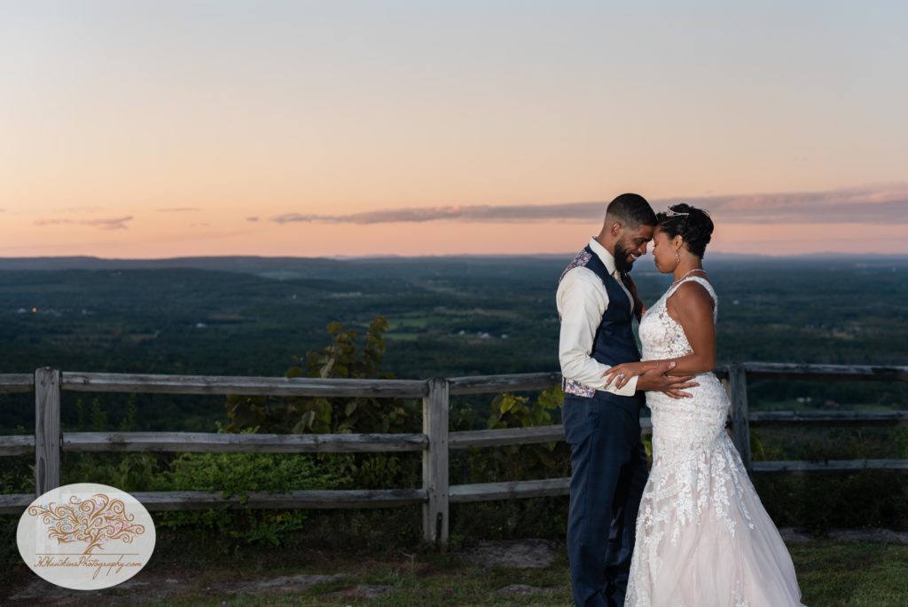 Bride and groom at sunset at their wedding reception at John Boyd Thatcher State Park