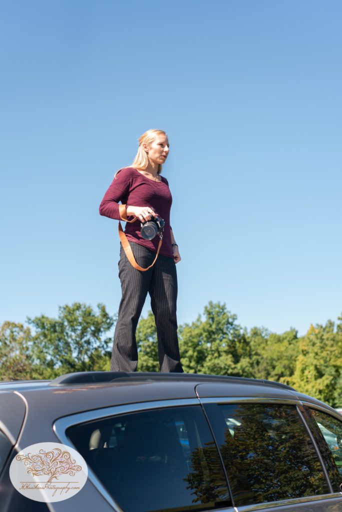 Syracuse wedding photographer stands on top of car to get an epic picture