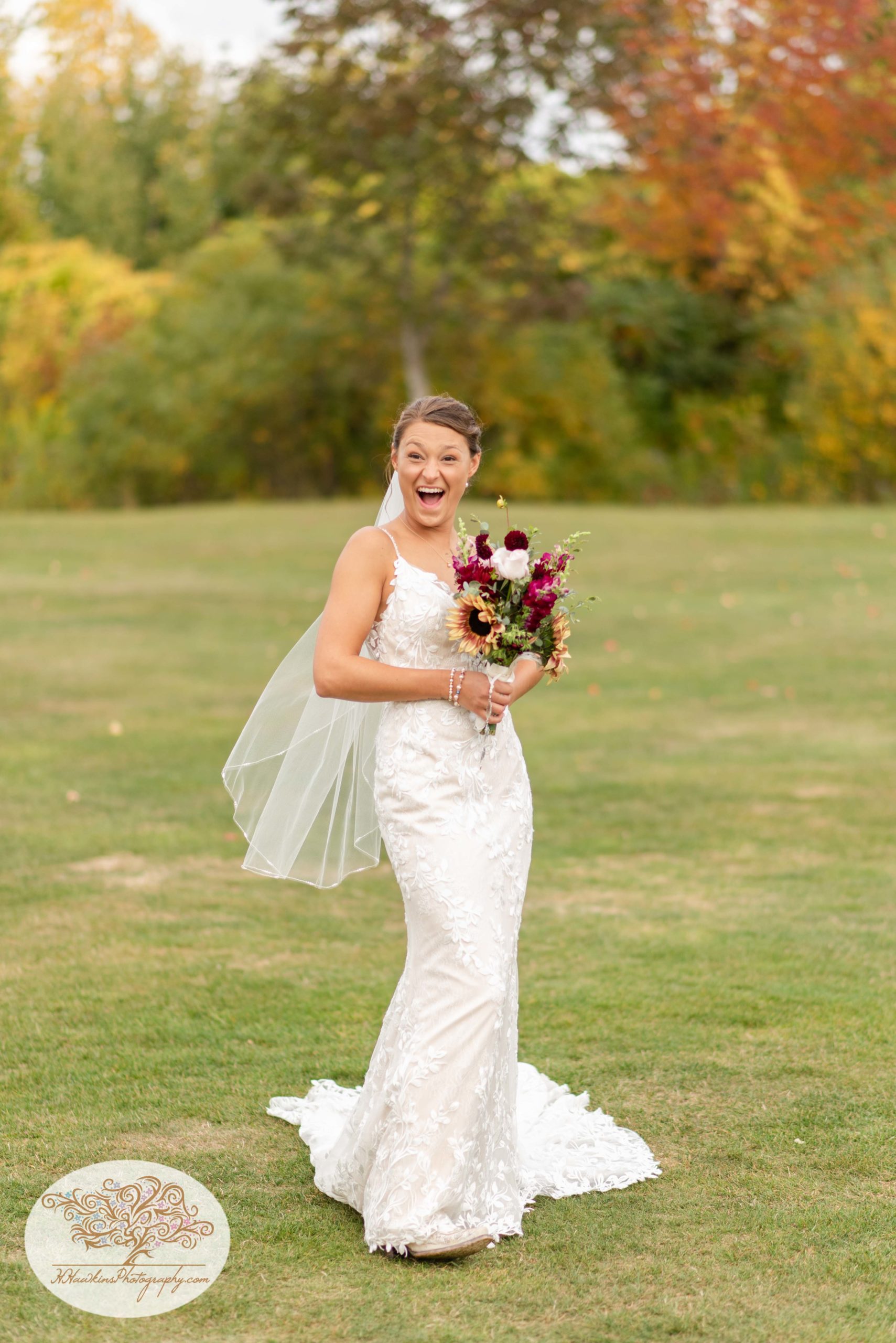 Bride laughs at the groom during their portrait session by Syracuse wedding photographer at The View at Sunset Pines Executive Golf Course