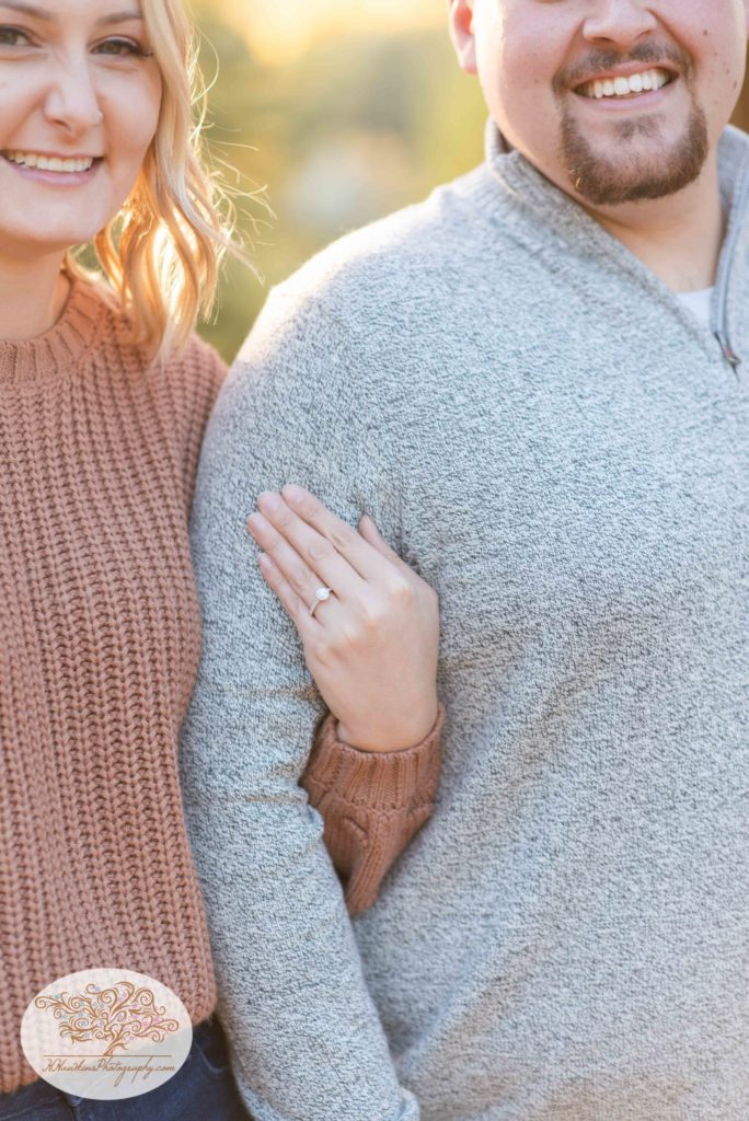 Diamond engagement ring is shown off right after boyfriend surprises his girlfriend with proposal by syracuse engagement photographer
