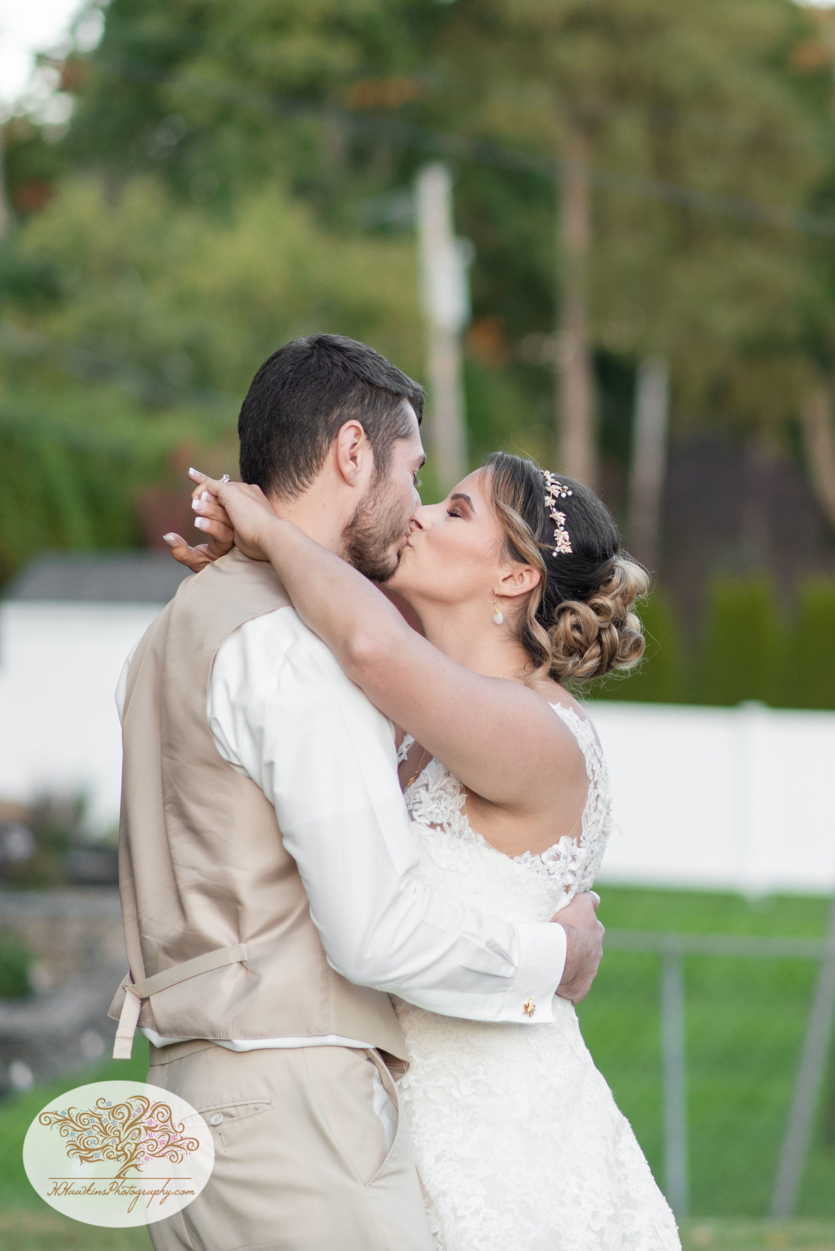 Bride kisses groom at the end of their first dance