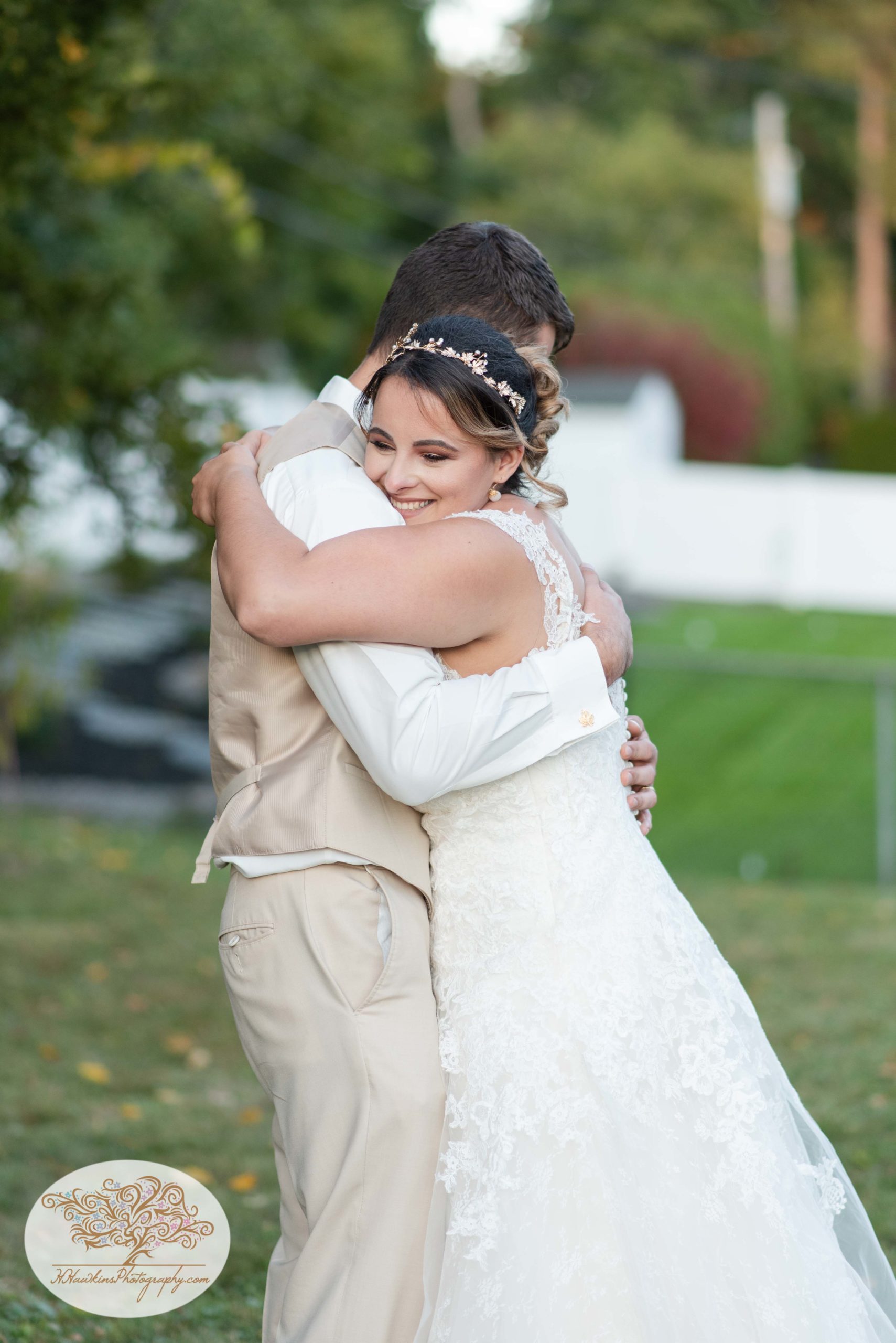 bride hugs the groom at the end of their first dance