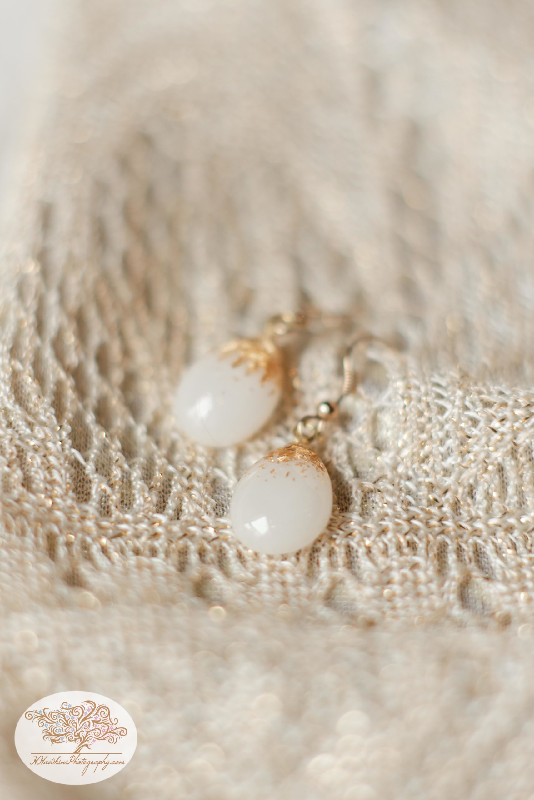 Brides earrings made out of breastmilk taken on purse