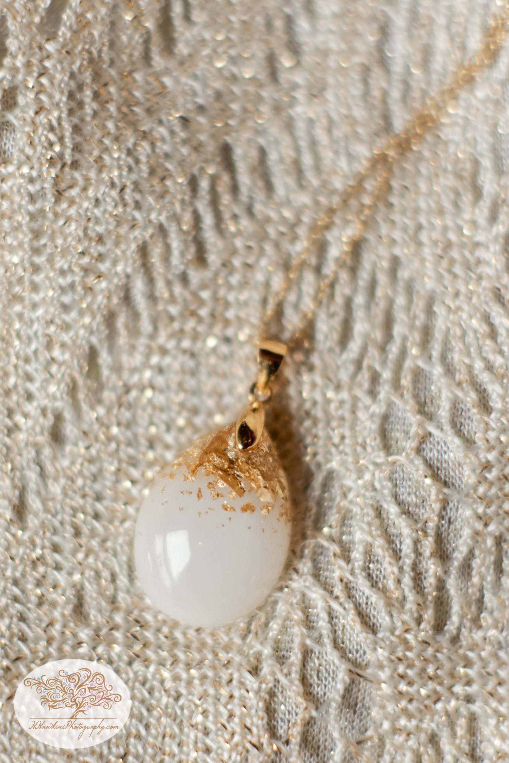 Bride's necklace made out of breastmilk with gold flecks