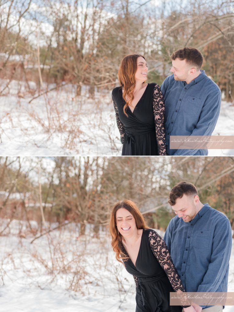 Snowy winter engagement pictures of bride in a black dress and groom in a jean shirt to be laughing together
