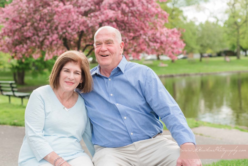 Grandparents pose together during their extended family session by Syracuse family photographer
