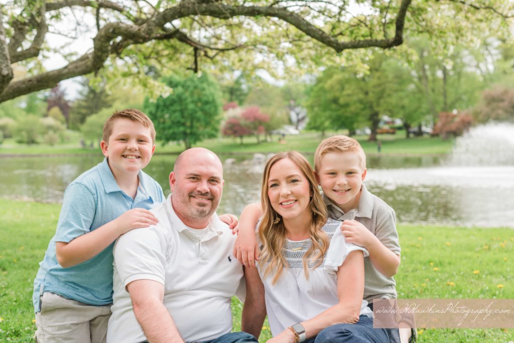 Portrait of mom, dad and their two boys at their extended family session at Hoopes Park Auburn NY by syracuse family photographer