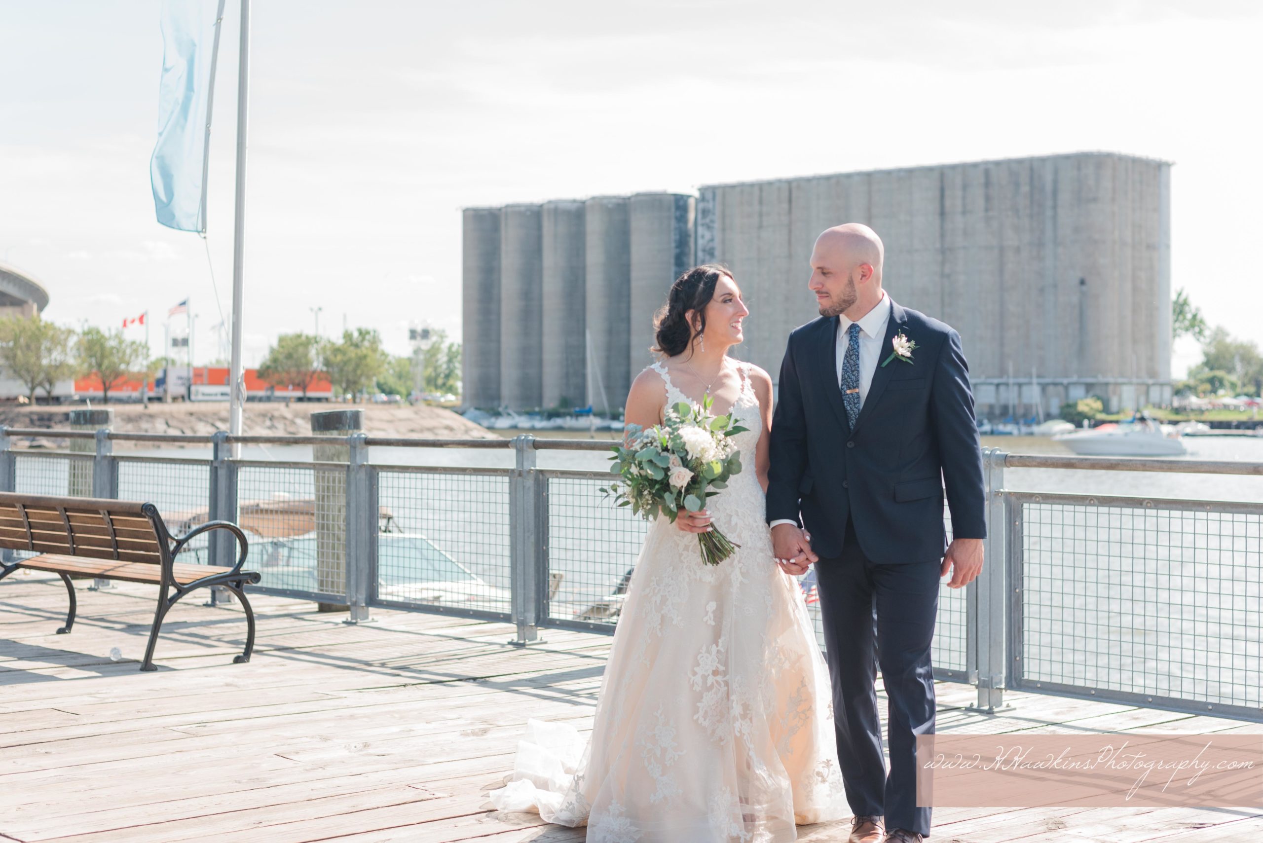 bride and groom at the boardwalk at canalside in downtown buffalo