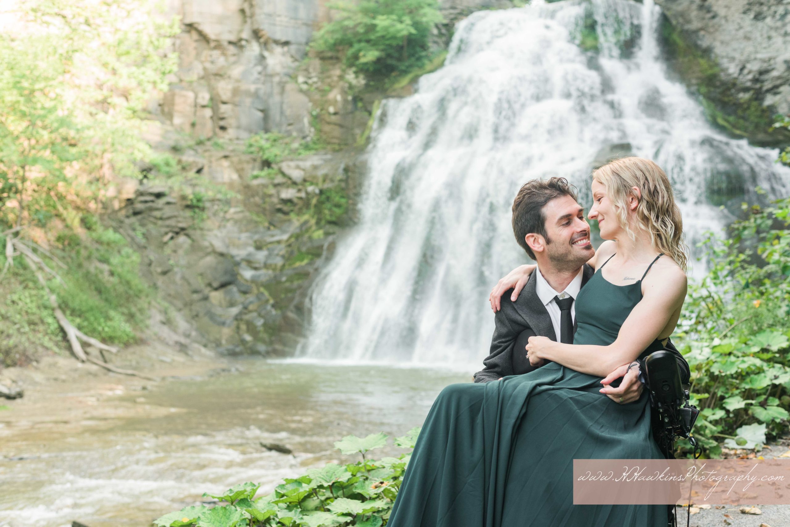 Picture of bride and groom to be during their engagement photo session at Delphi Falls in Cazenovia NY by Syracuse wedding photographer