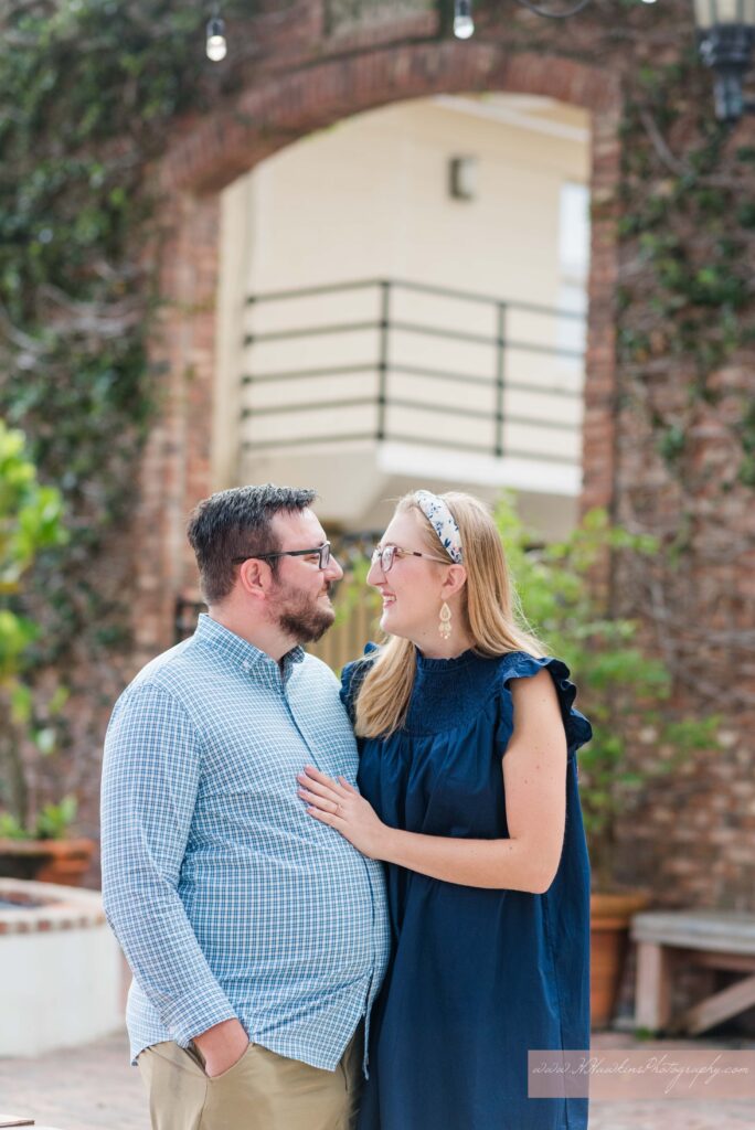 Guy and girl outside of CFS Coffee Shop in Winter Park for their engagement photos