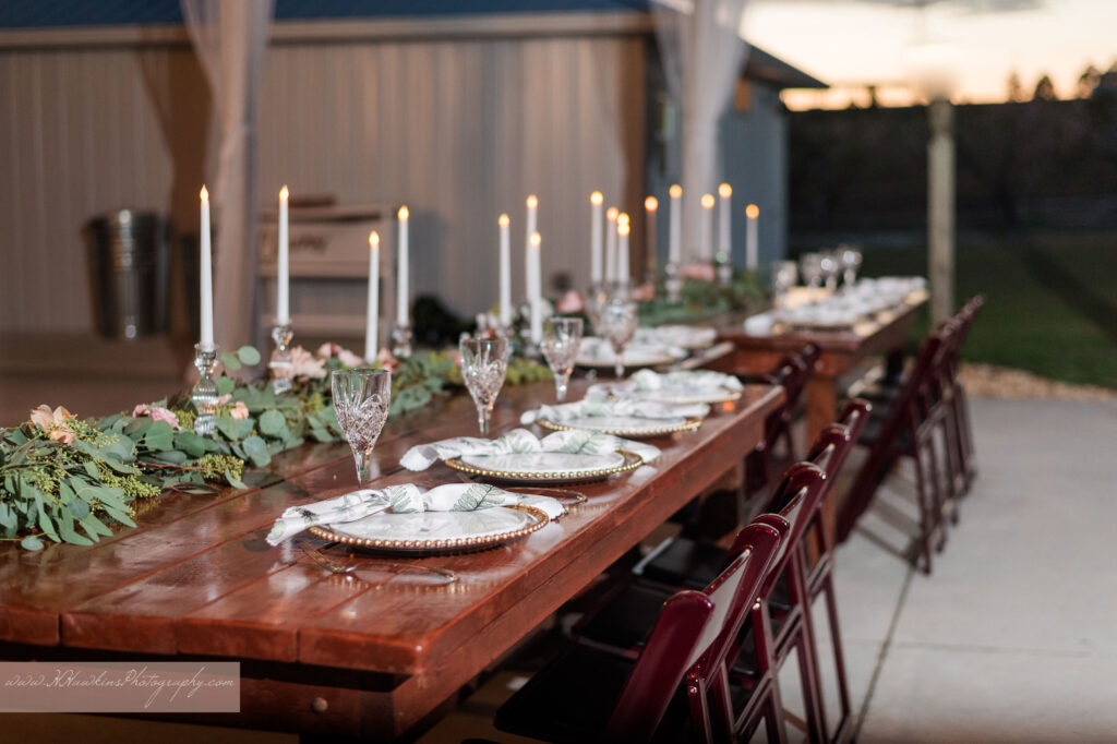 Tablescape in pole barn at Acres of Grace Family Farms wedding venue in Howey in the Hills FL