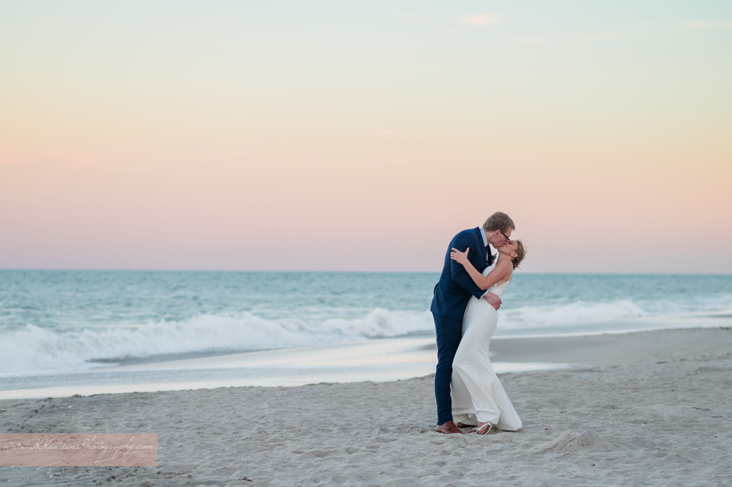 Beach ocean wedding pictures for bride and groom at sunset at the Hilton Melbourne Beach Oceanfront Resort