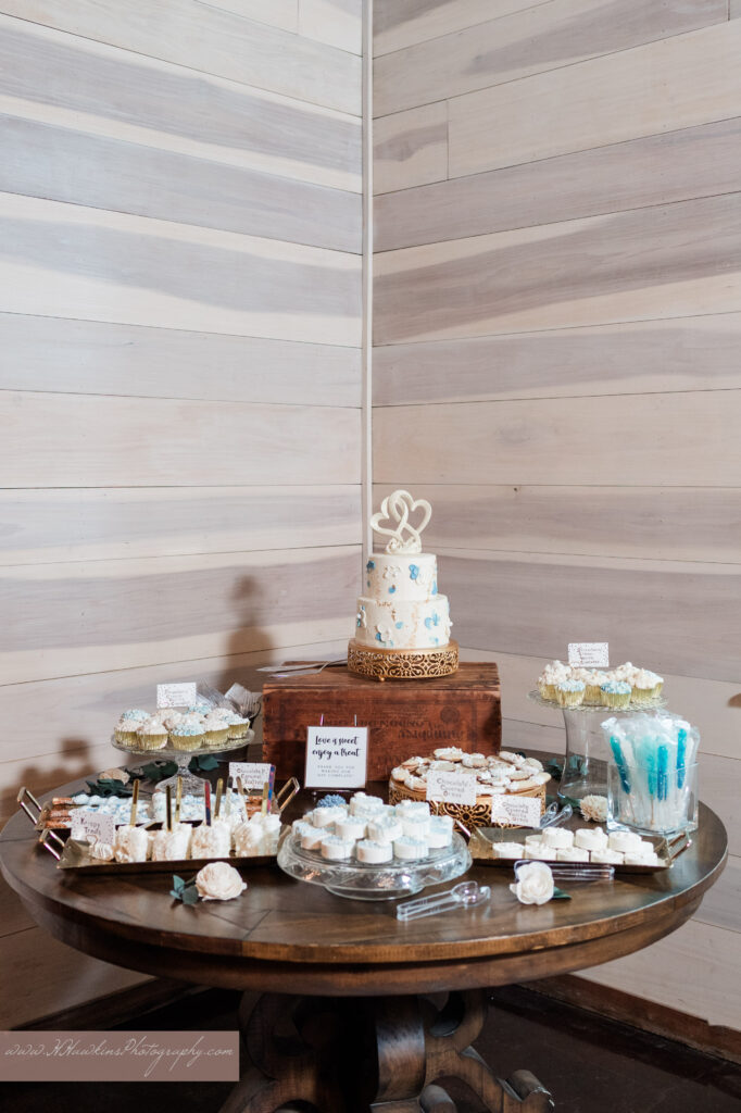 Wedding cake and treats at wedding reception at Granville Farms Wedding venue in Lake Helen FL