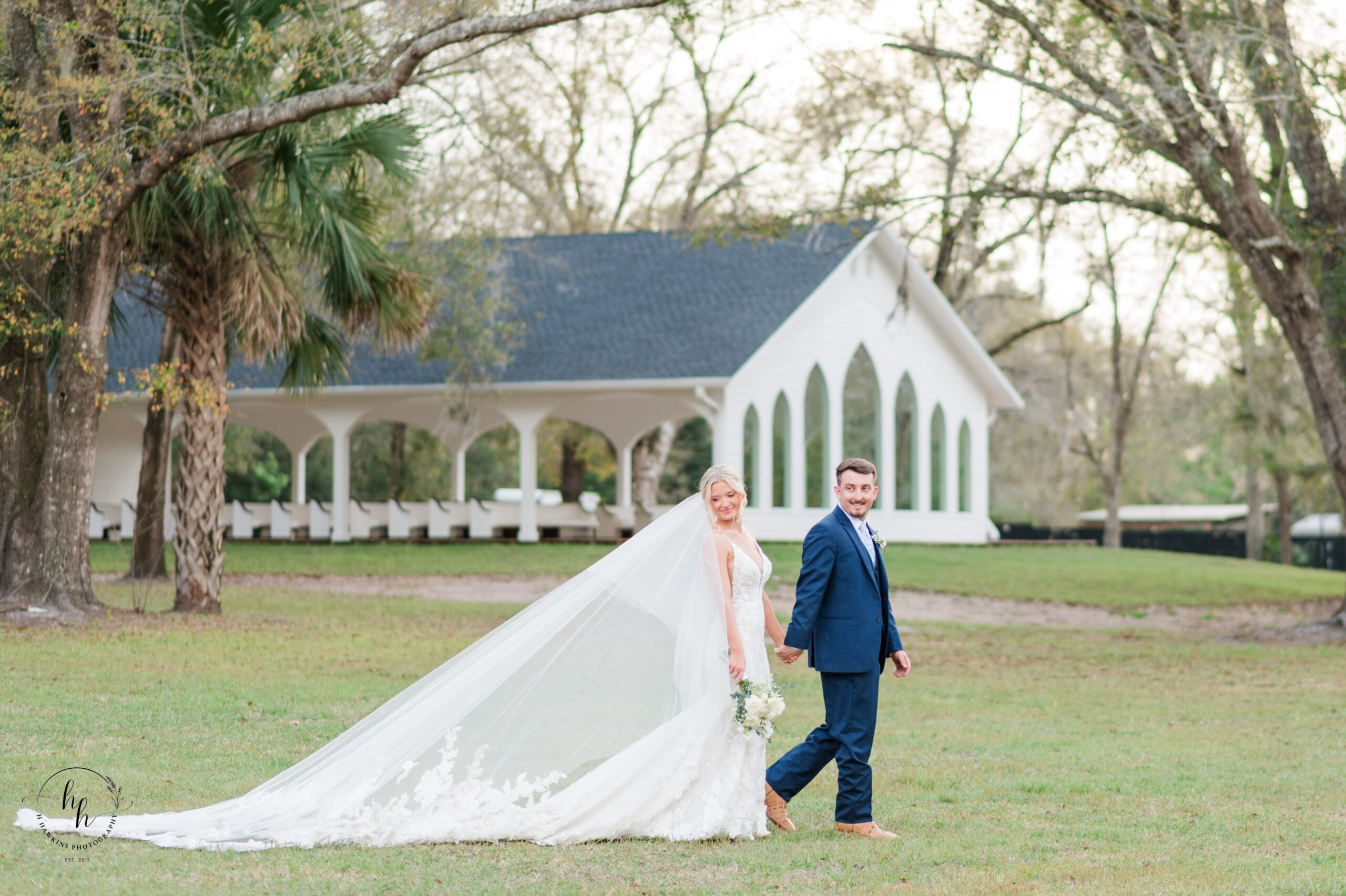 Bride with cathedral veil during golden hour portraits at Whitewood Ranch outside of Esme Lane Chapel